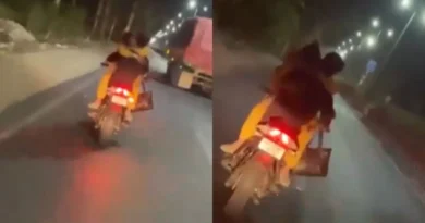 couple kiss on bike